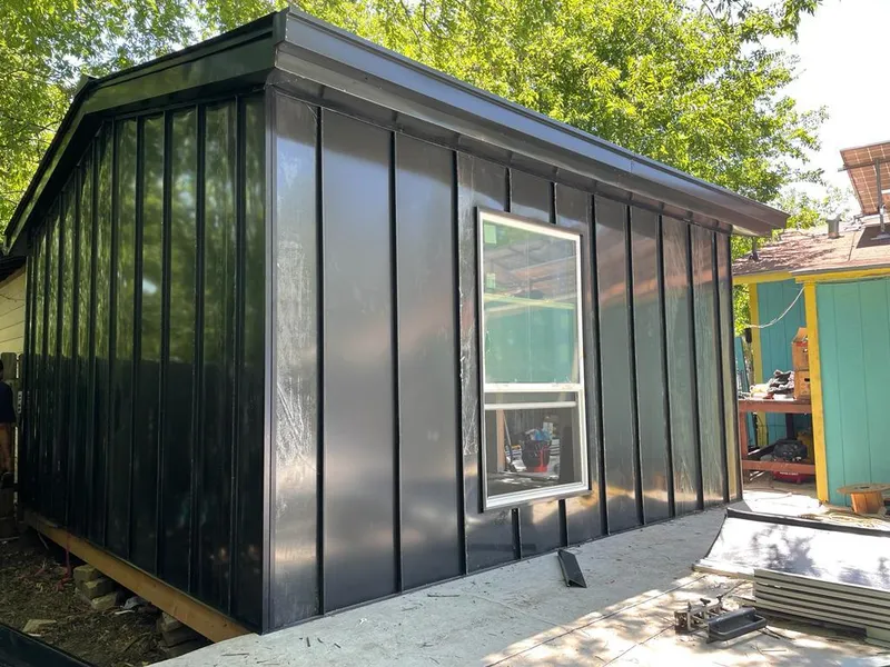 Black standing seam metal wall panels for Roof Inspection in South Cleveland